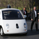 Chief technical officer of Google’s self-driving car project, Chris Urmson, shows one of the company’s cars to U.S. Transportation Secretary Anthony Foxx and Google chairman Eric Schmidt. Photo credit: Justin Sullivan/Getty Images